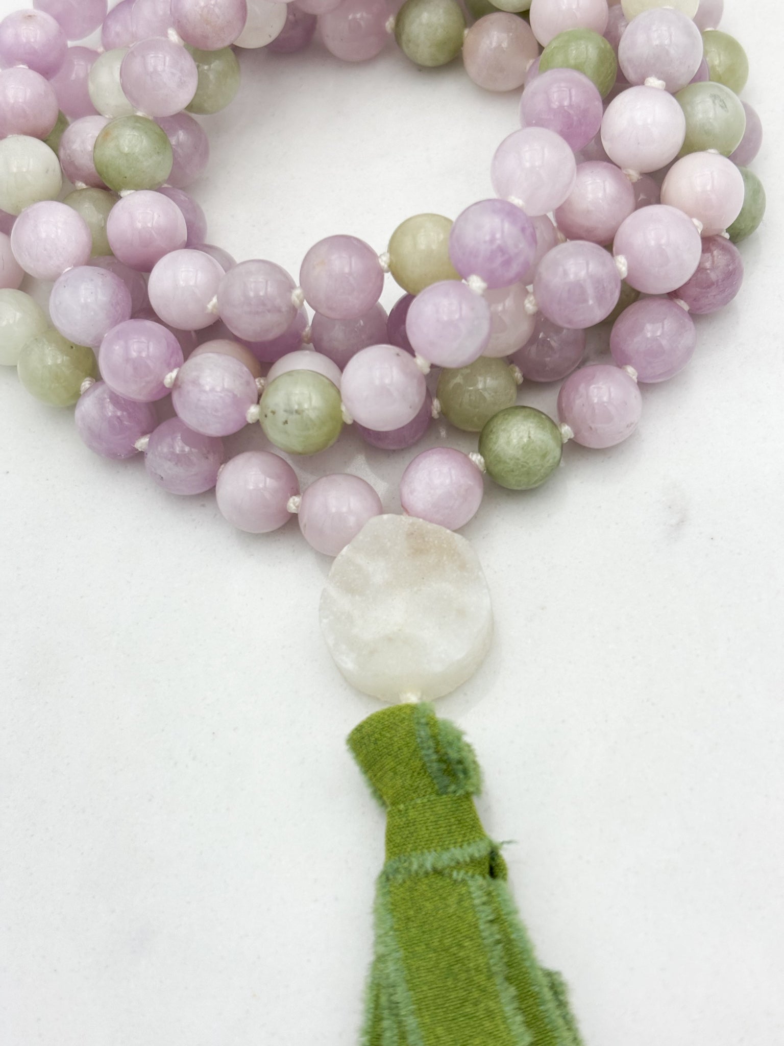 kunzite gemstone mala with druzy quartz guru bead and green silk tassel | radiant malas | handmade in boulder, colorado
