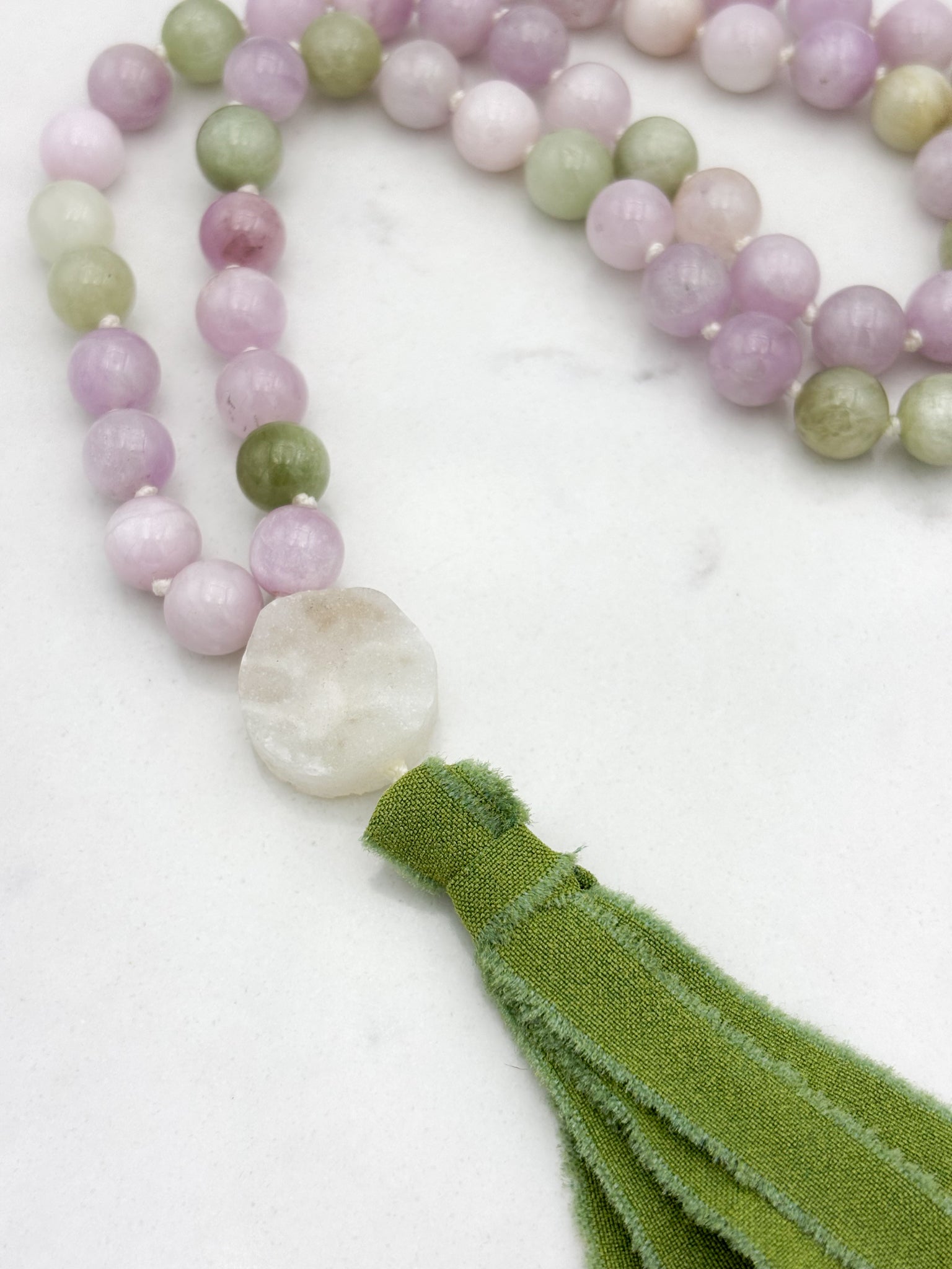 kunzite gemstone mala with druzy quartz guru bead and green silk tassel | radiant malas | handmade in boulder, colorado