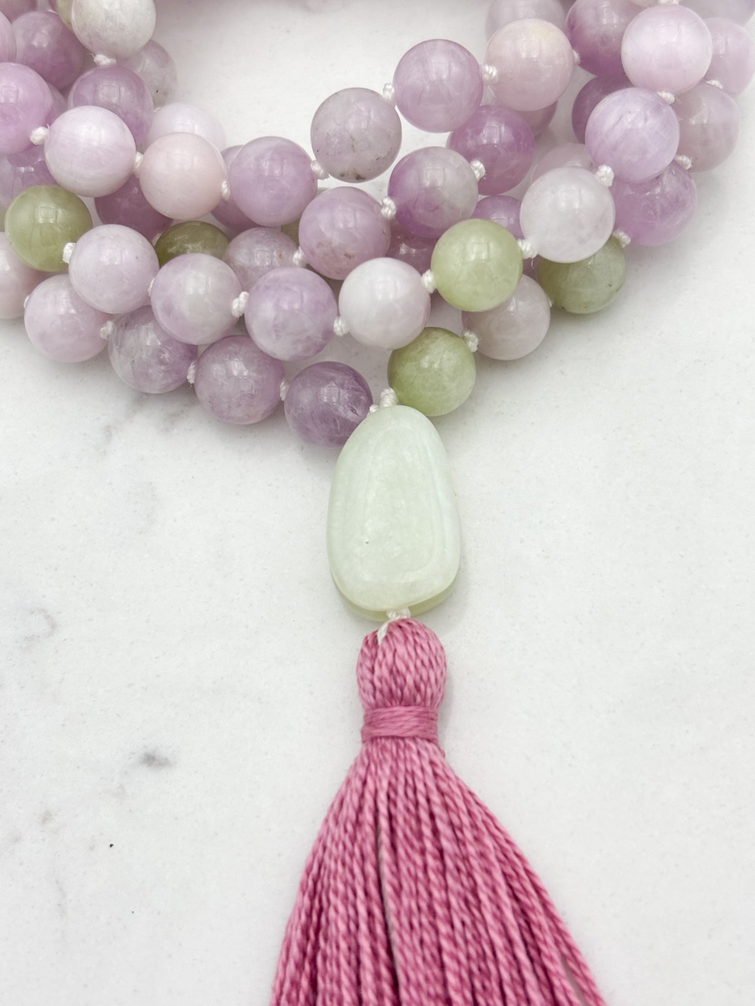 kunzite gemstone mala with jade guru bead and pink tassel | radiant malas  handmade in boulder, colorado