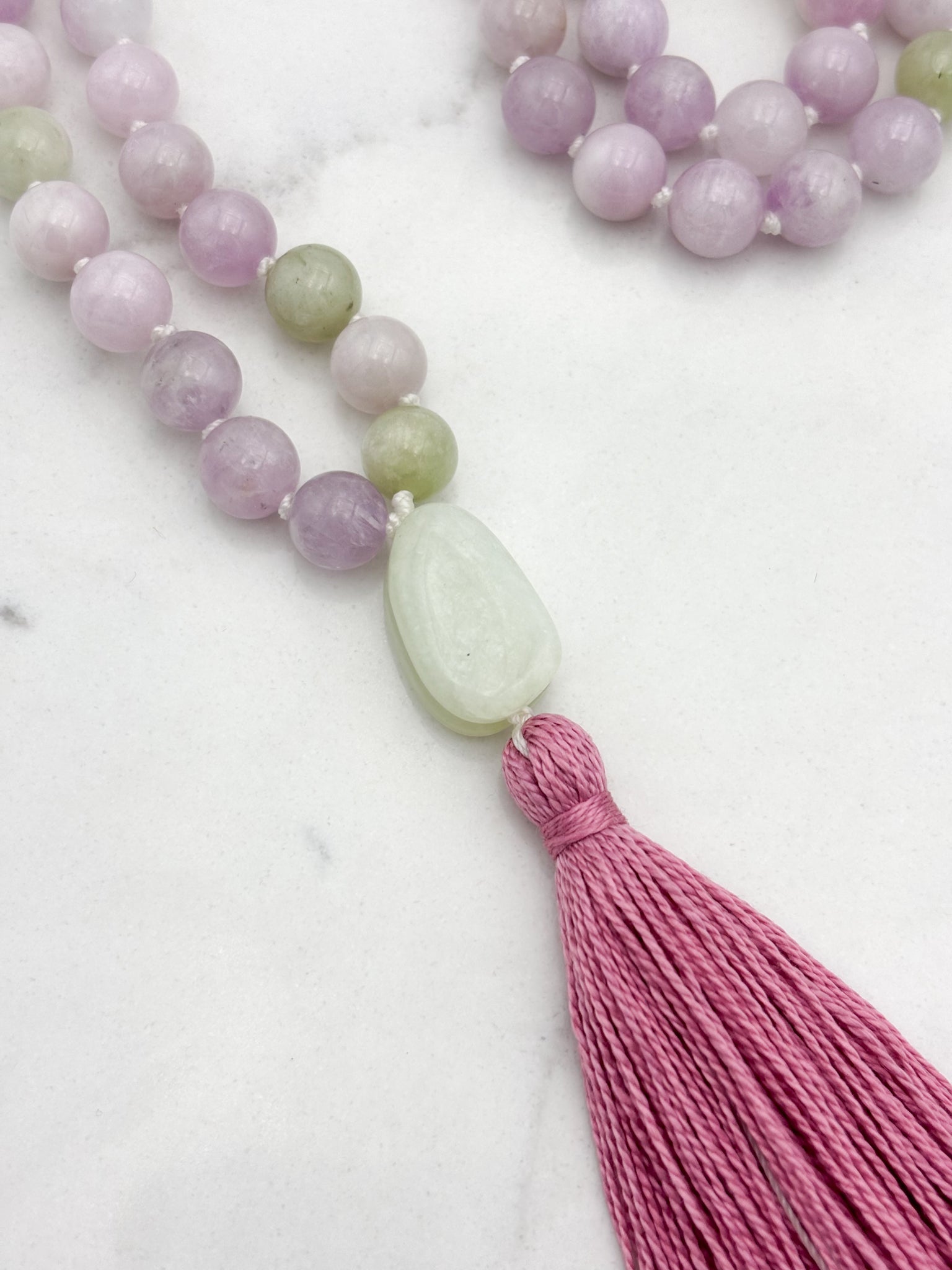kunzite gemstone mala with jade guru bead and pink tassel | radiant malas  handmade in boulder, colorado