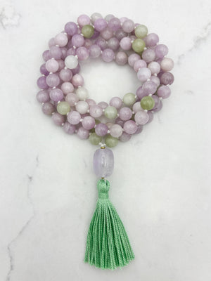 kunzite gemstone mala with lilac amethyst guru bead and green tassel | radiant malas  handmade in boulder, colorado