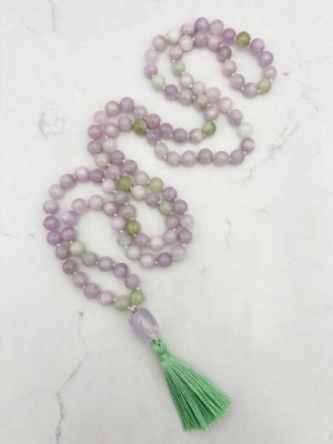 kunzite gemstone mala with lilac amethyst guru bead and green tassel | radiant malas  handmade in boulder, colorado