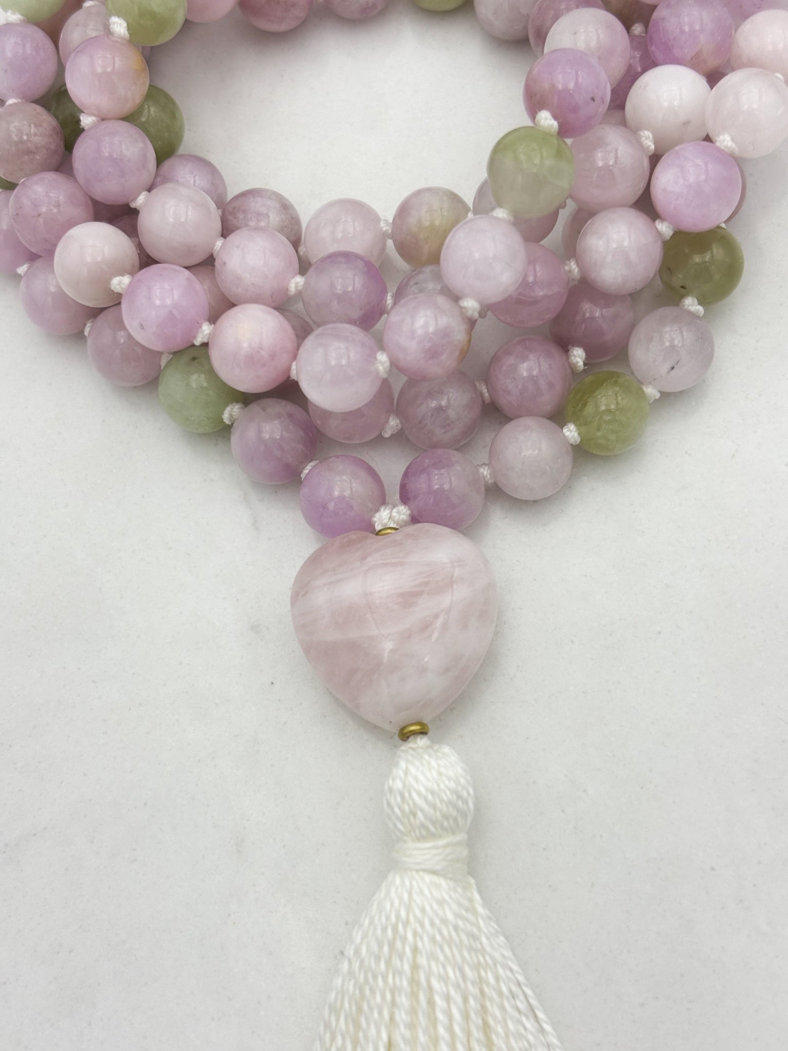 kunzite gemstone mala with rose quartz heart guru bead and white tassel | radiant malas | handmade in boulder, colorado