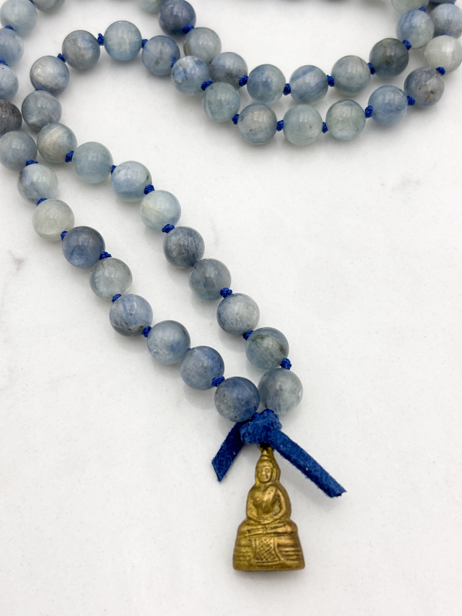 kyanite gemstone mala with brass buddha pendant | radiant malas | handmade in boulder, colorado