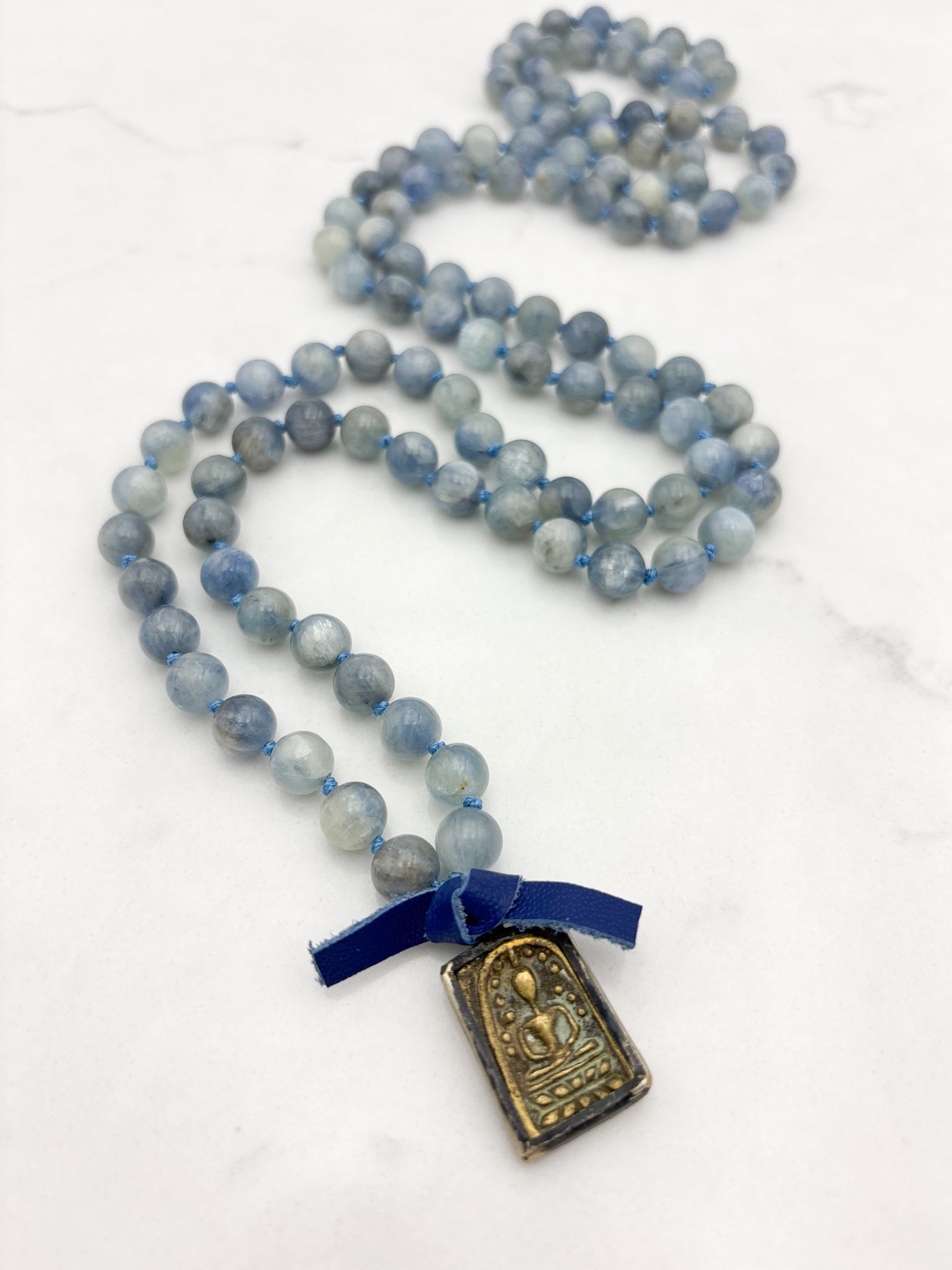 kyanite gemstone mala with brass buddha pendant | radiant malas | handmade in boulder, colorado