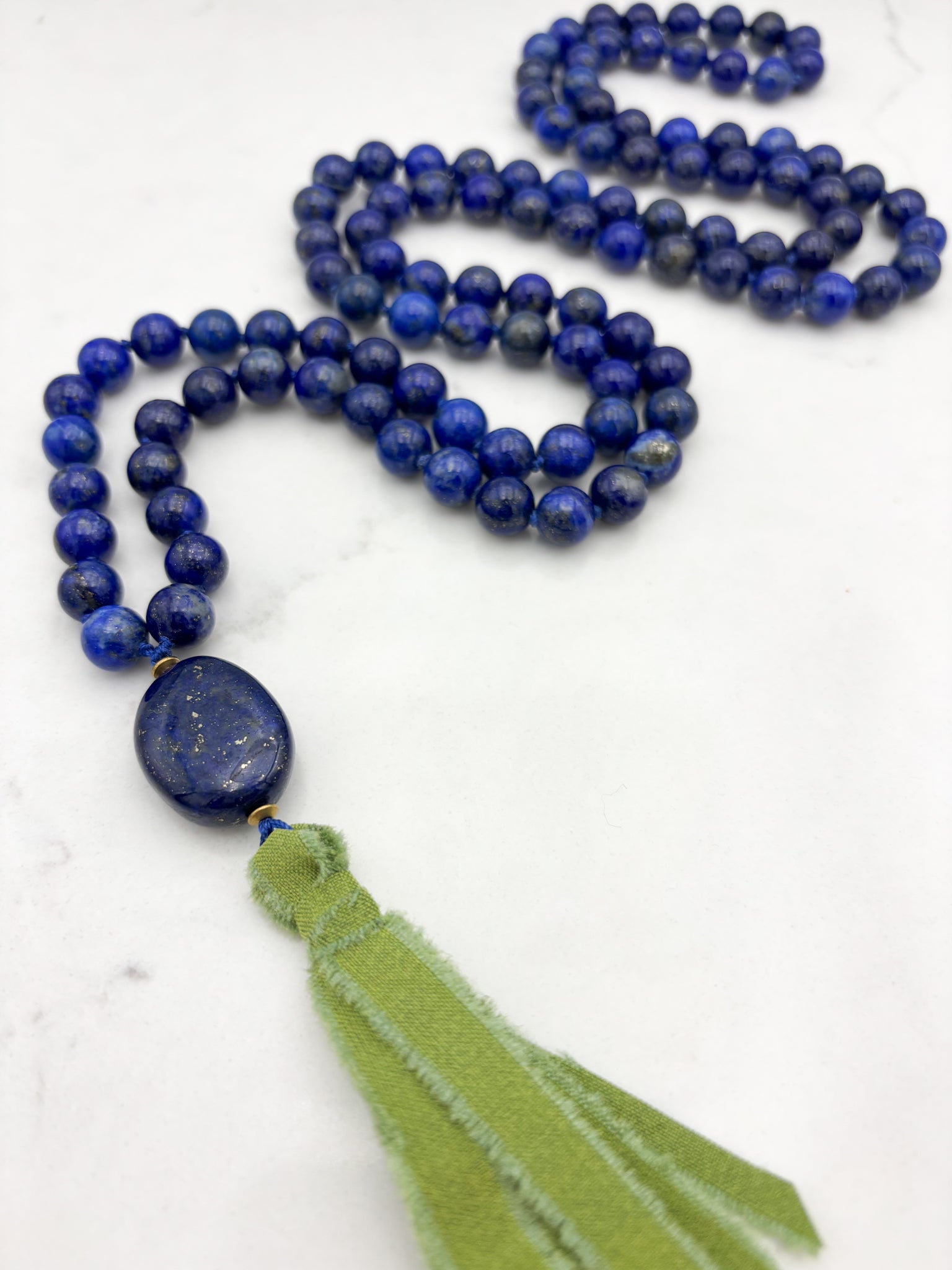 lapis gemstone mala necklace with lapis guru bead and green silk ribbon tassel | radiant malas | handmade in boulder, colorado