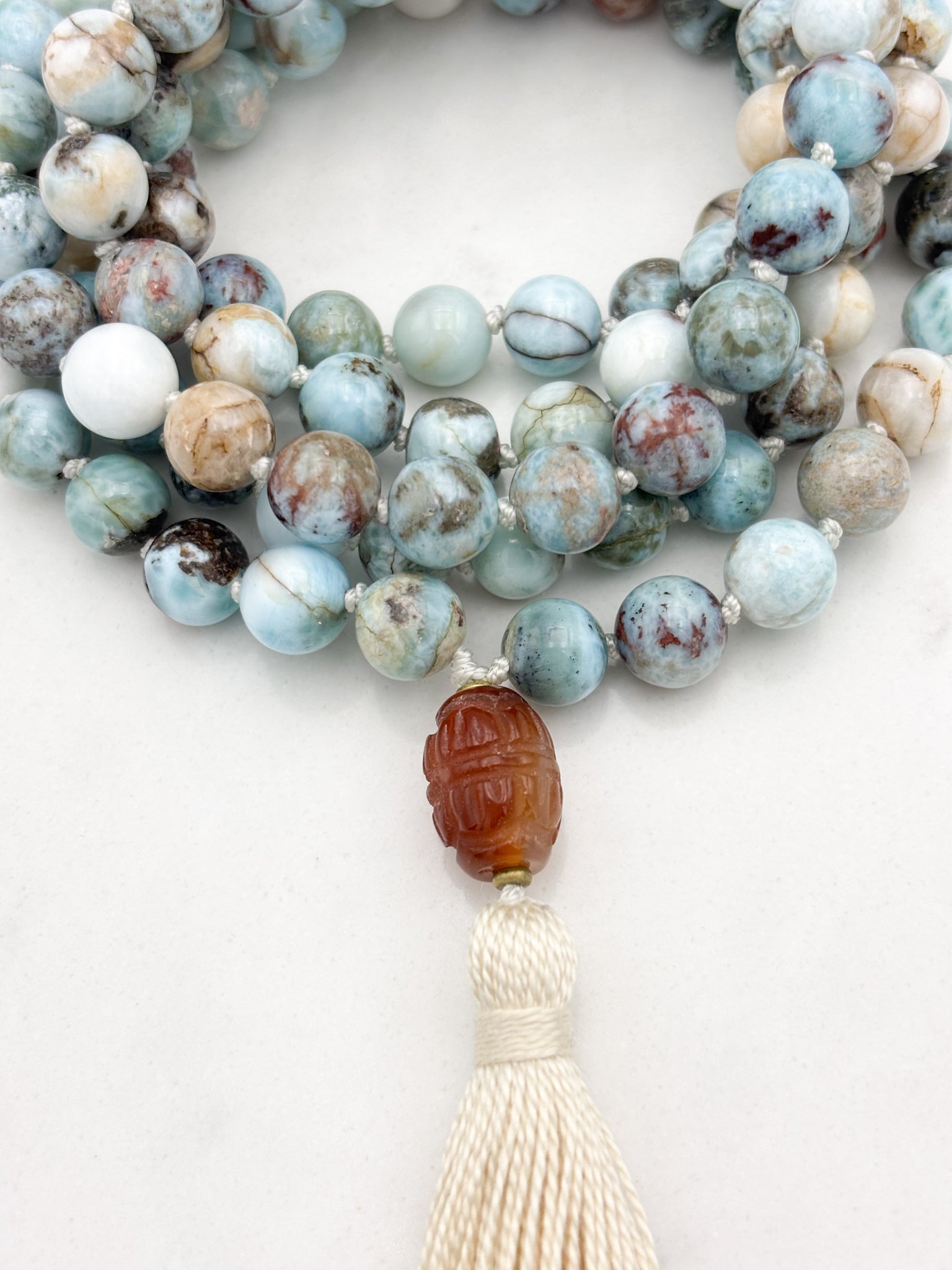 larimar gemstone mala with carnelian guru bead and ecru tassel | radiant malas | handmade in boulder, colorado