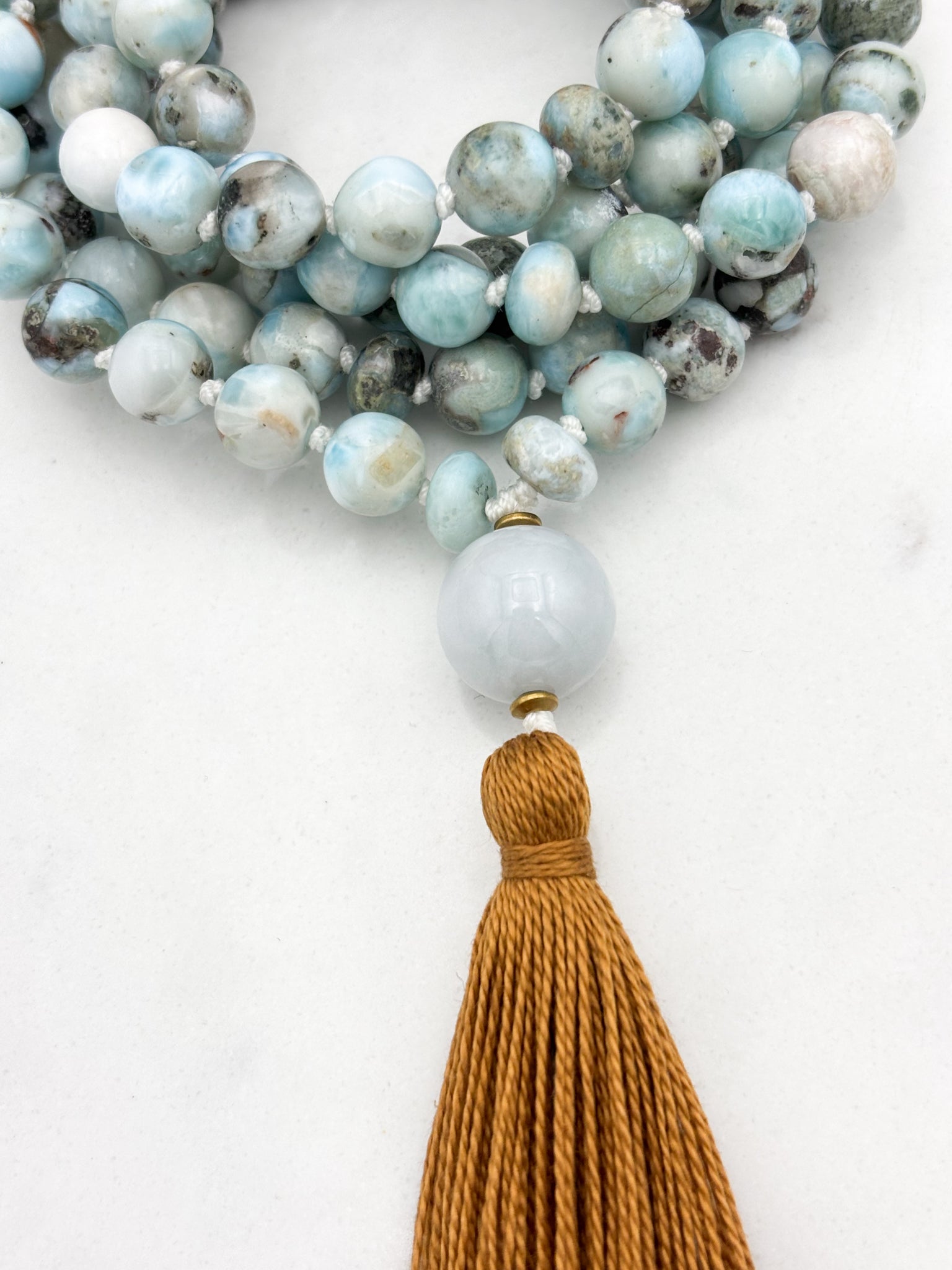 larimar gemstone malas wtih jade guru bead and rust colored tassel | radiant malas | handmade in boulder, colorado