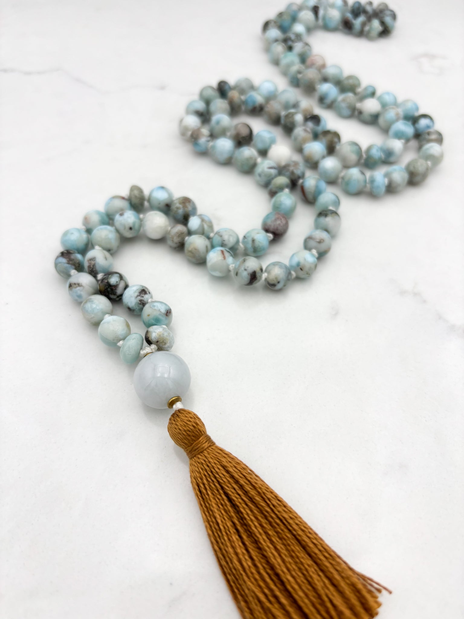 larimar gemstone malas wtih jade guru bead and rust colored tassel | radiant malas | handmade in boulder, colorado