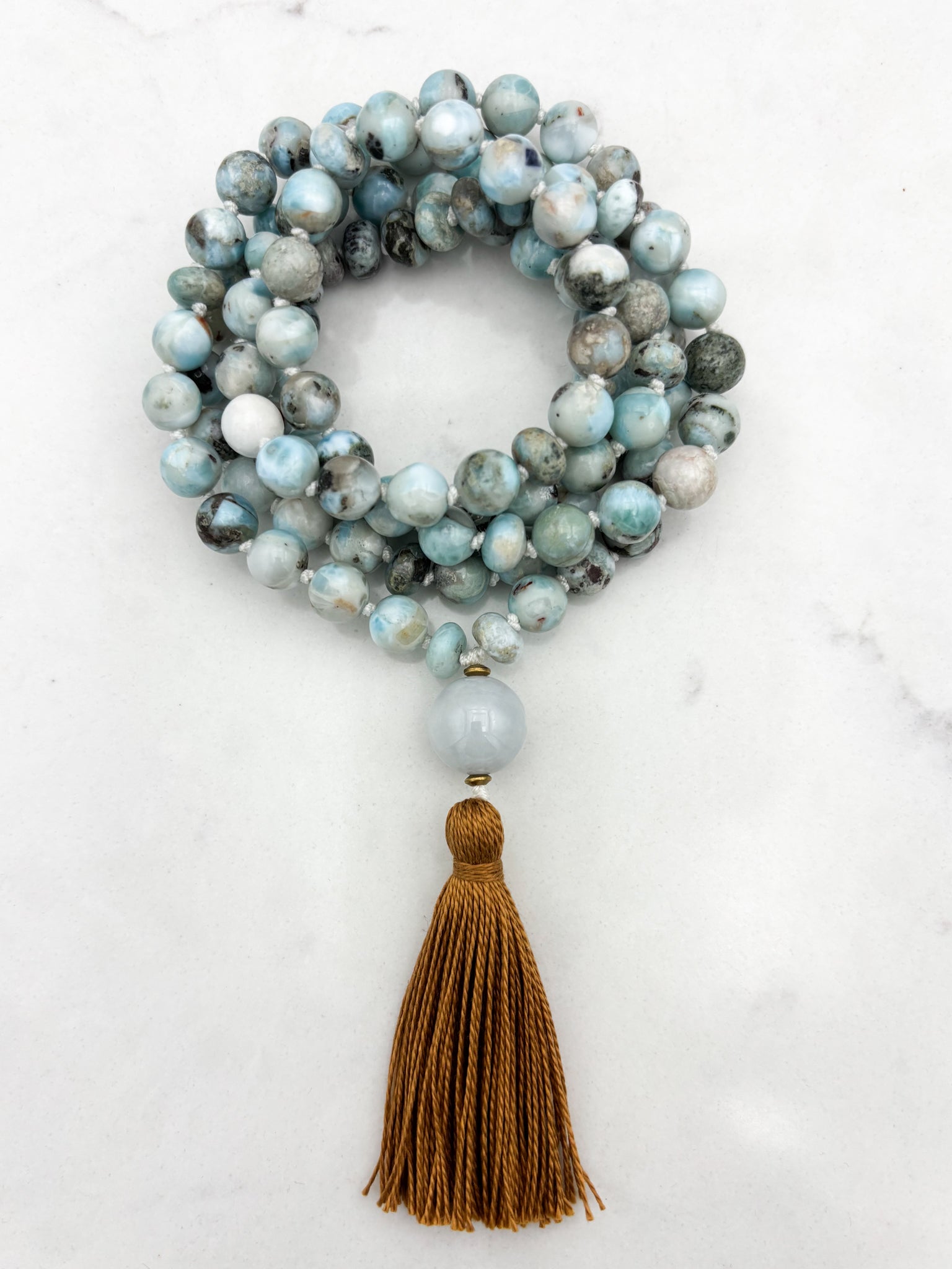 larimar gemstone malas wtih jade guru bead and rust colored tassel | radiant malas | handmade in boulder, colorado