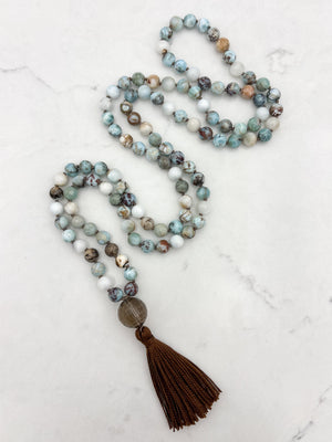 larimar gemstone mala with smoky quartz guru bead and brown tassel | radiant malas | handmade in boulder, colorado