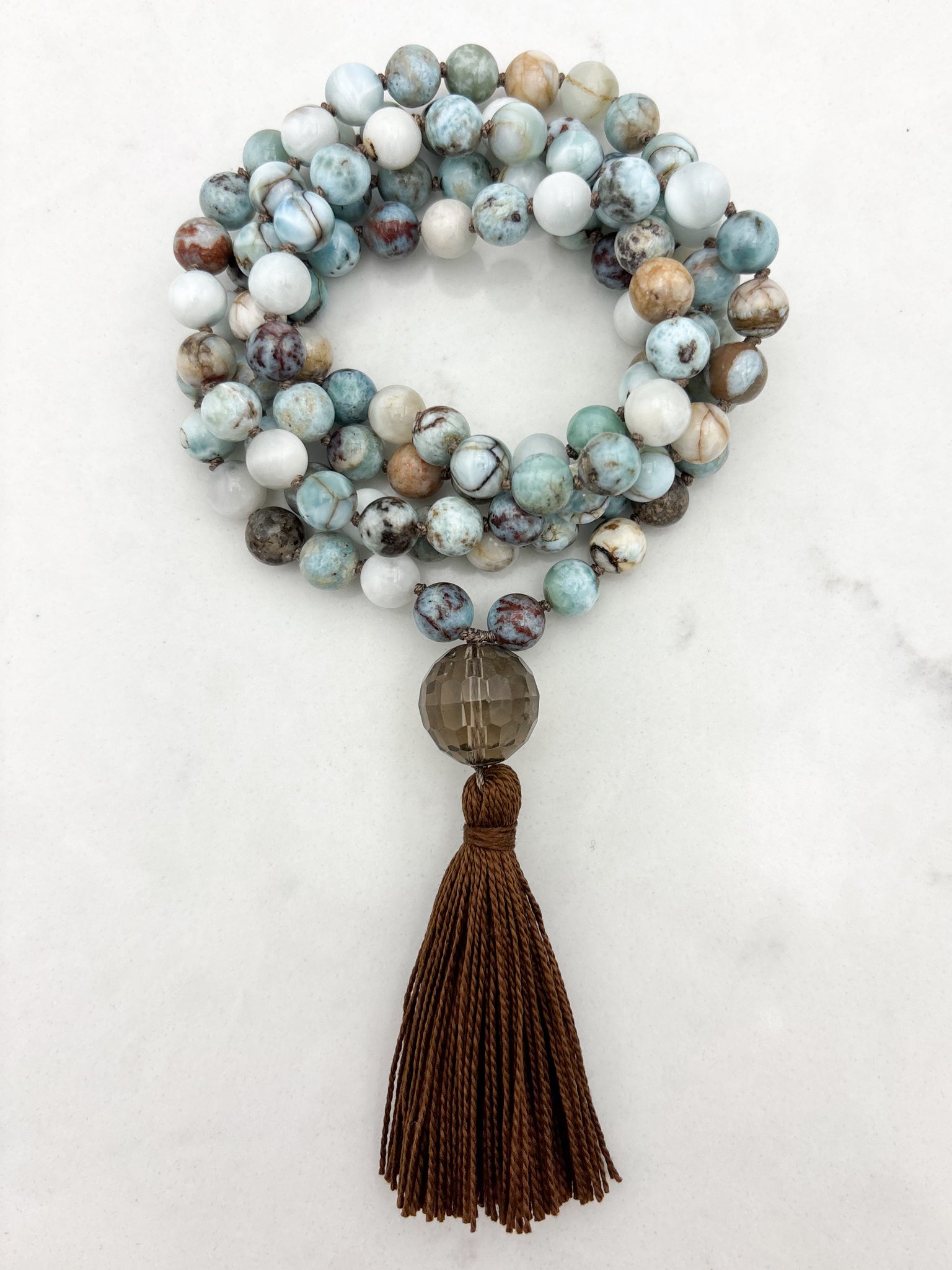 larimar gemstone mala with smoky quartz guru bead and brown tassel | radiant malas | handmade in boulder, colorado