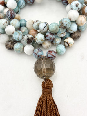 larimar gemstone mala with smoky quartz guru bead and brown tassel | radiant malas | handmade in boulder, colorado