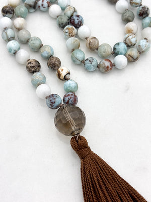 larimar gemstone mala with smoky quartz guru bead and brown tassel | radiant malas | handmade in boulder, colorado