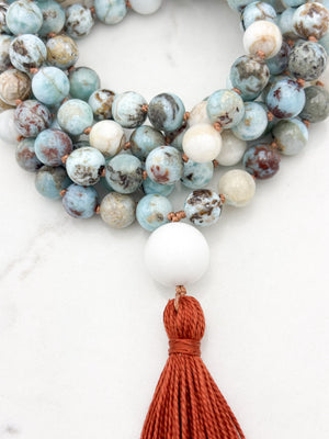 larimar gemstone mala with white agate guru bead and rust tassel | radiant malas | handmade in boulder, colorado