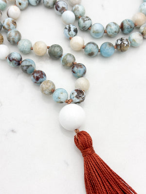 larimar gemstone mala with white agate guru bead and rust tassel | radiant malas | handmade in boulder, colorado
