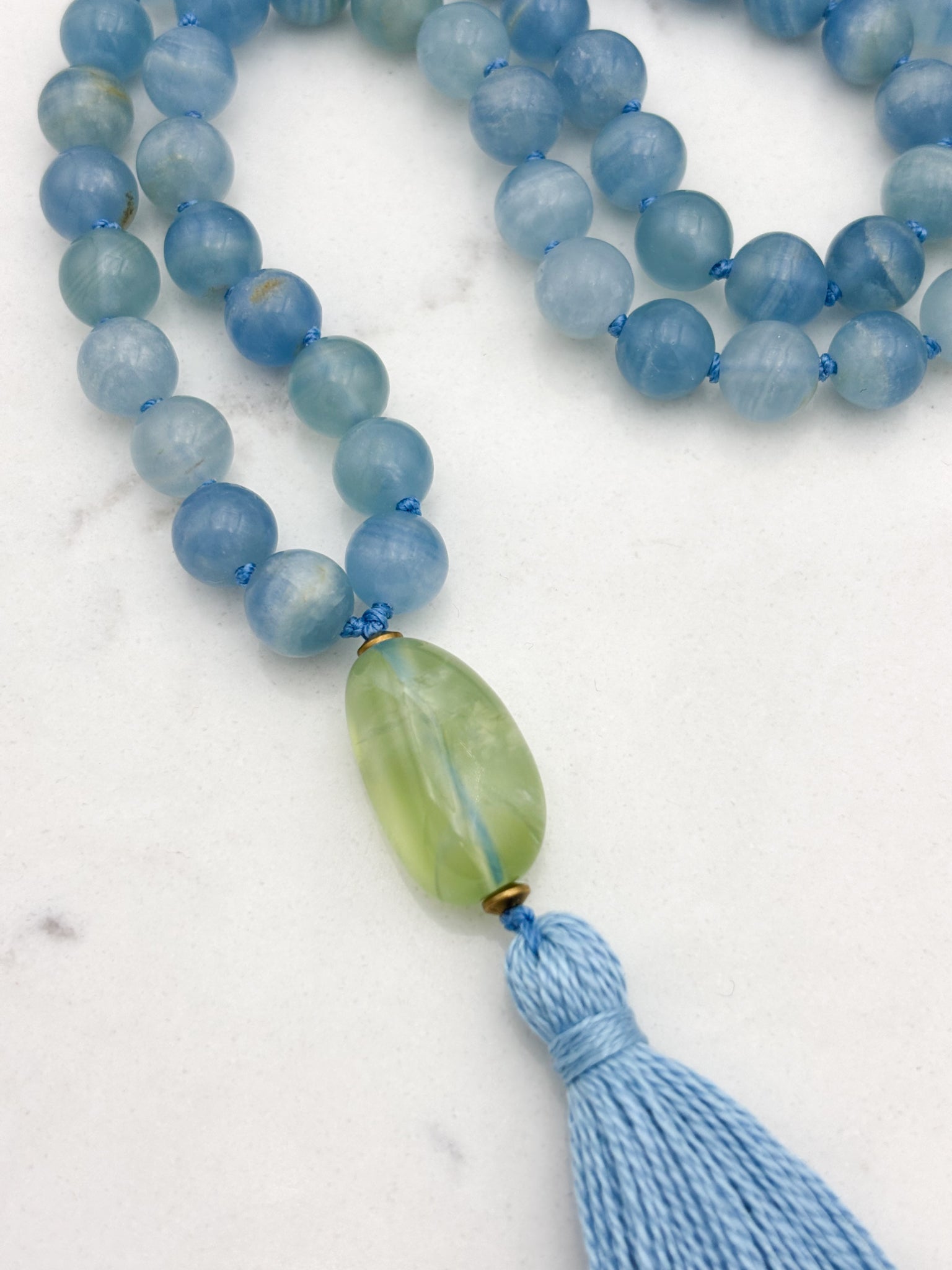 lemurian aquatine calcite gemstone mala with fluorite guru bead and blue tassel | radiant malas | handmade in boulder, colorado