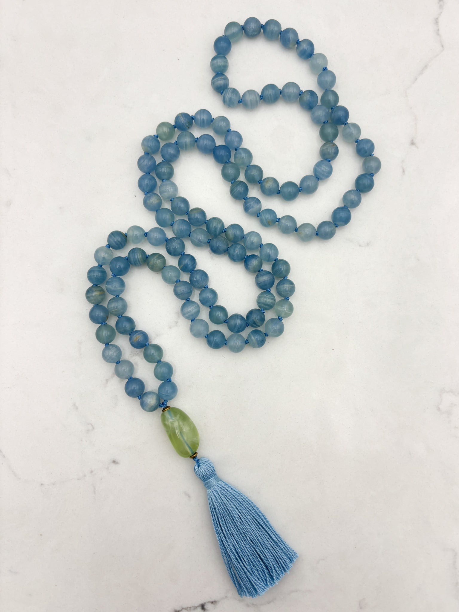 lemurian aquatine calcite gemstone mala with fluorite guru bead and blue tassel | radiant malas | handmade in boulder, colorado