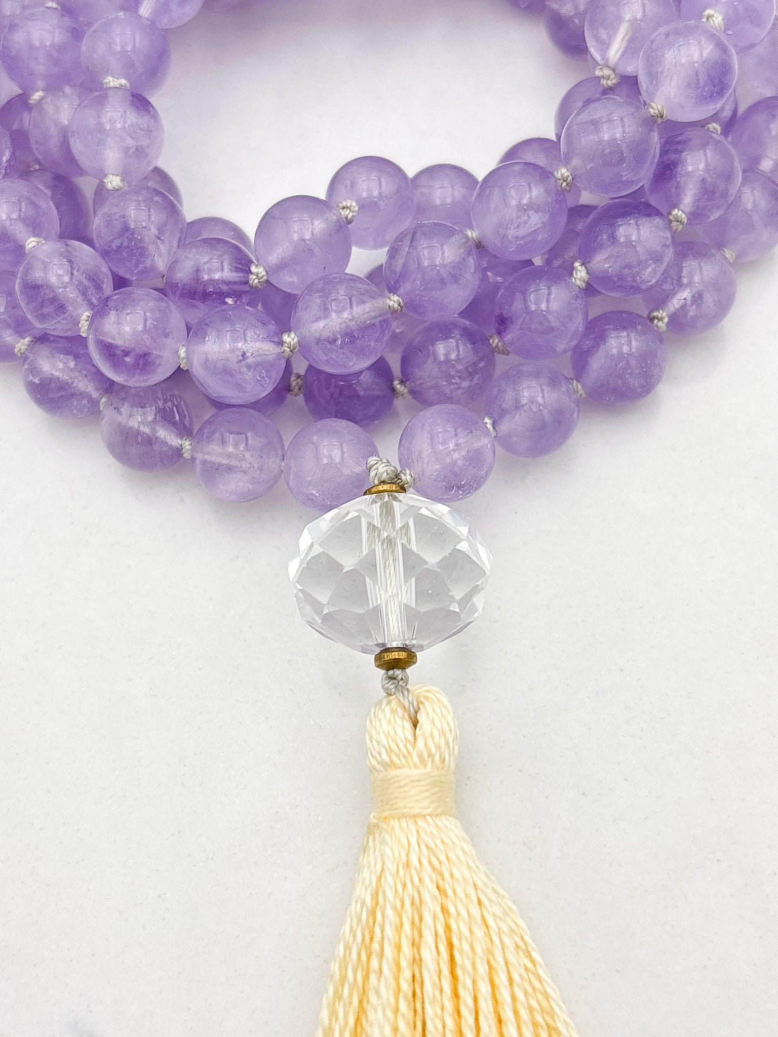lilac amethyst gemstone mala with faceted quartz guru bead and yellow tassel | radiant malas | handmade in boulder, colorado