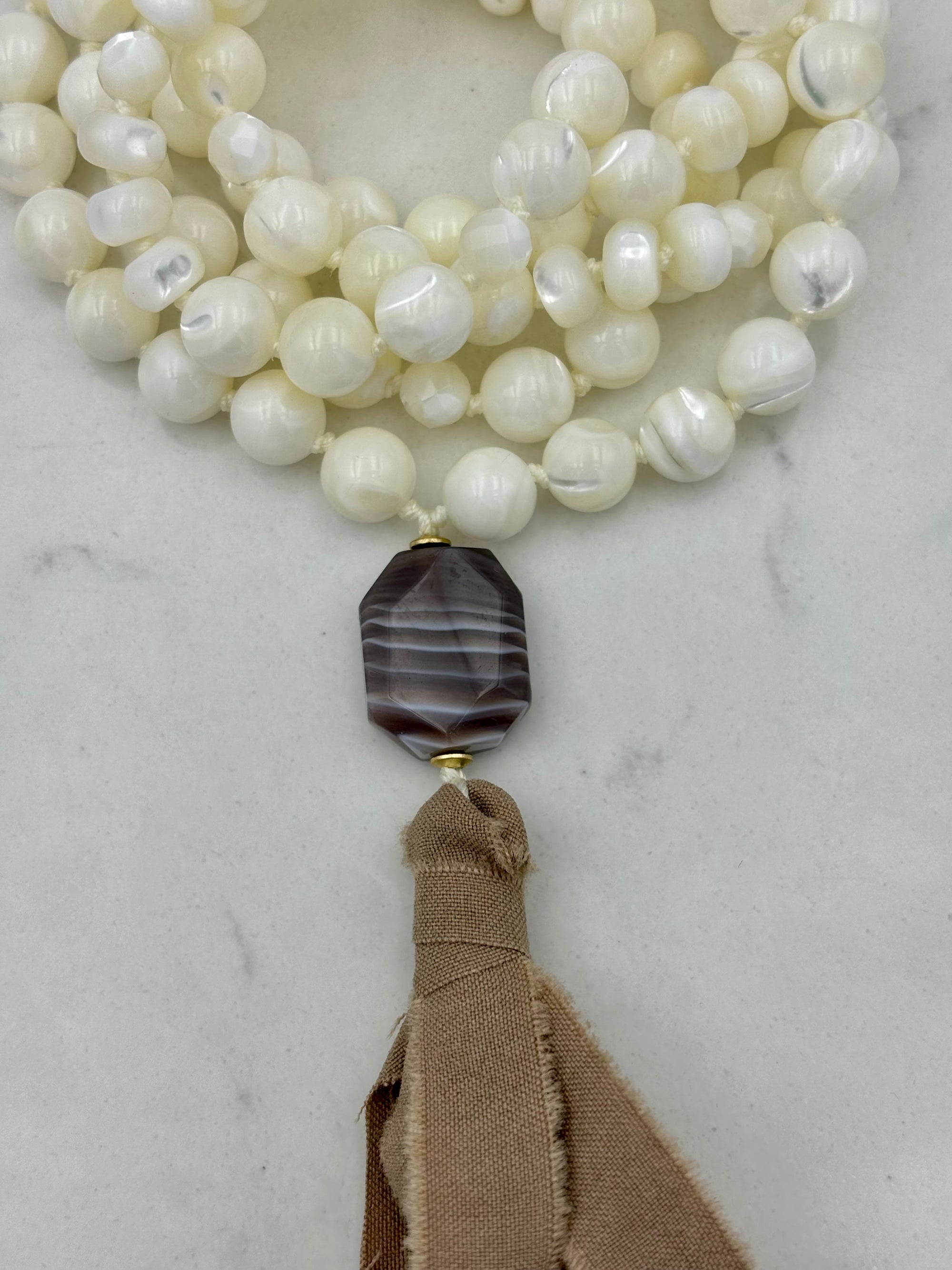 mother of pearl mala necklace | silk ribbon tassel | radiant malas | handmade in Boulder, colorado