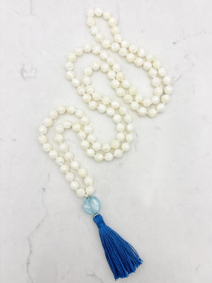 mother of pearl gemstone mala with blue lampwork glass guru bead and blue tassel | radiant malas | handmade in boulder, colorado