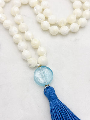 mother of pearl gemstone mala with blue lampwork glass guru bead and blue tassel | radiant malas | handmade in boulder, colorado