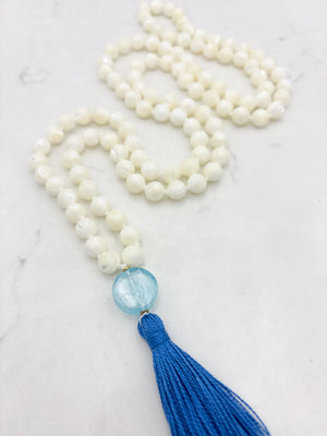 mother of pearl gemstone mala with blue lampwork glass guru bead and blue tassel | radiant malas | handmade in boulder, colorado