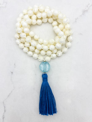 mother of pearl gemstone mala with blue lampwork glass guru bead and blue tassel | radiant malas | handmade in boulder, colorado