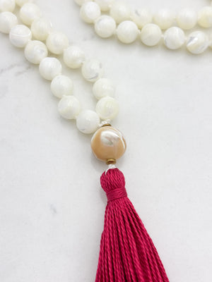 mother of pearl gemstone mala with mother of pearl guru bead and pink tassel | radiant malas | handmade in boulder, colorado