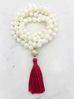 mother of pearl gemstone mala with mother of pearl guru bead and pink tassel | radiant malas | handmade in boulder, colorado