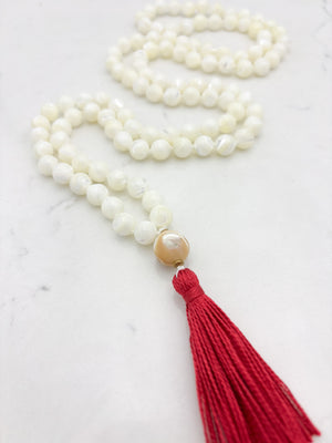 mother of pearl gemstone mala with mother of pearl guru bead and pink tassel | radiant malas | handmade in boulder, colorado