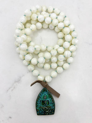 mother of pearl gemstone mala necklace with green brass buddha pendant | radiant malas | handmade in boulder, colorado