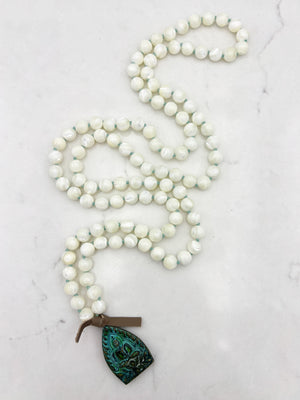 mother of pearl gemstone mala necklace with green brass buddha pendant | radiant malas | handmade in boulder, colorado
