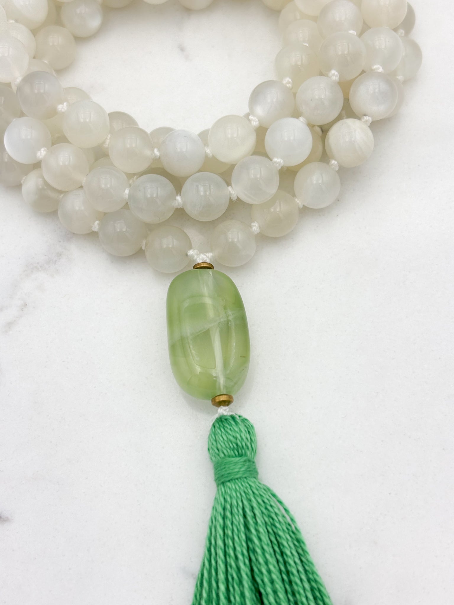moonstone gemstone mala necklace with fluorite guru bead and green tassel | handmade in boulder, colorado | radiant malas