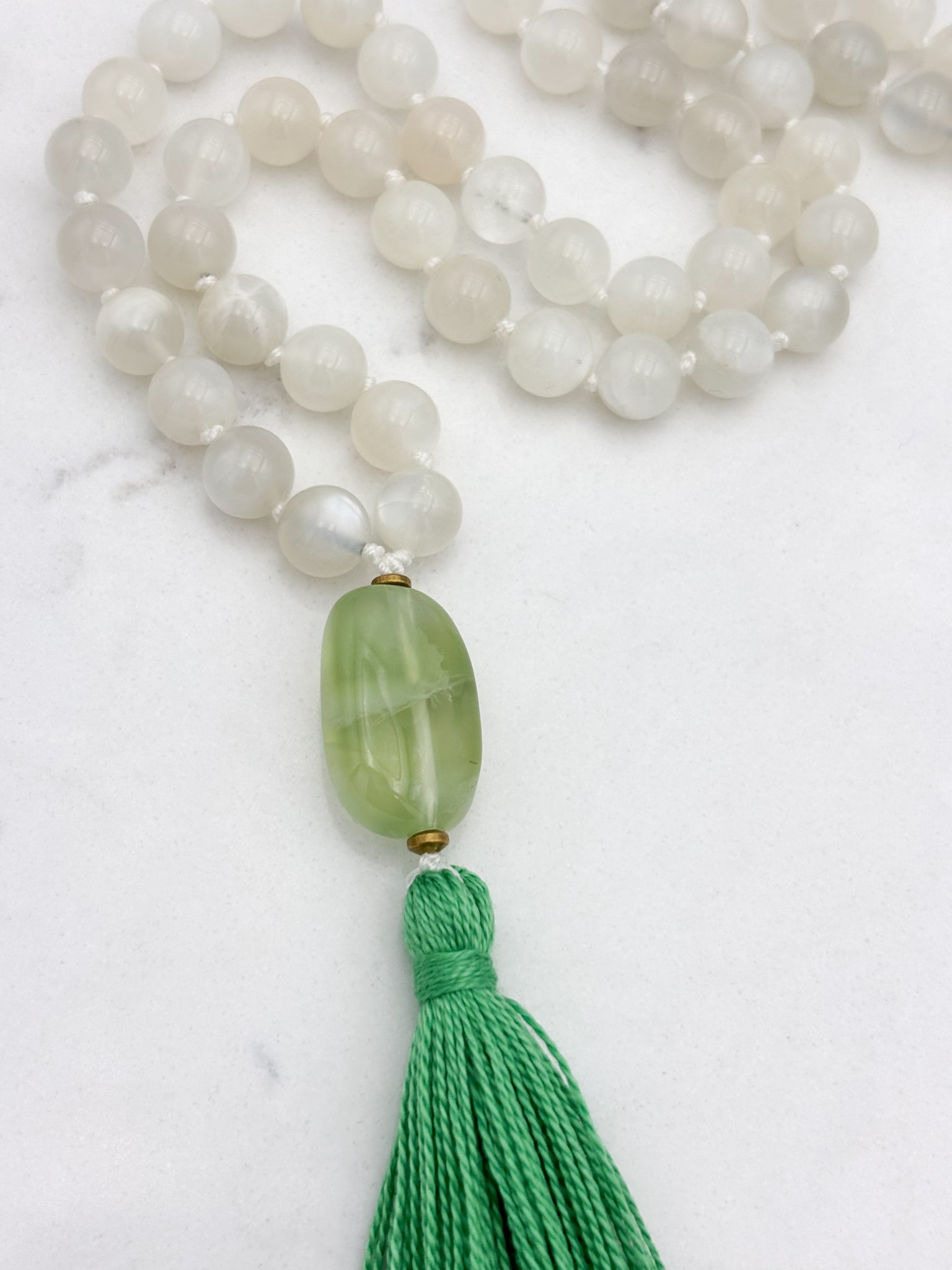 moonstone gemstone mala necklace with fluorite guru bead and green tassel | handmade in boulder, colorado | radiant malas
