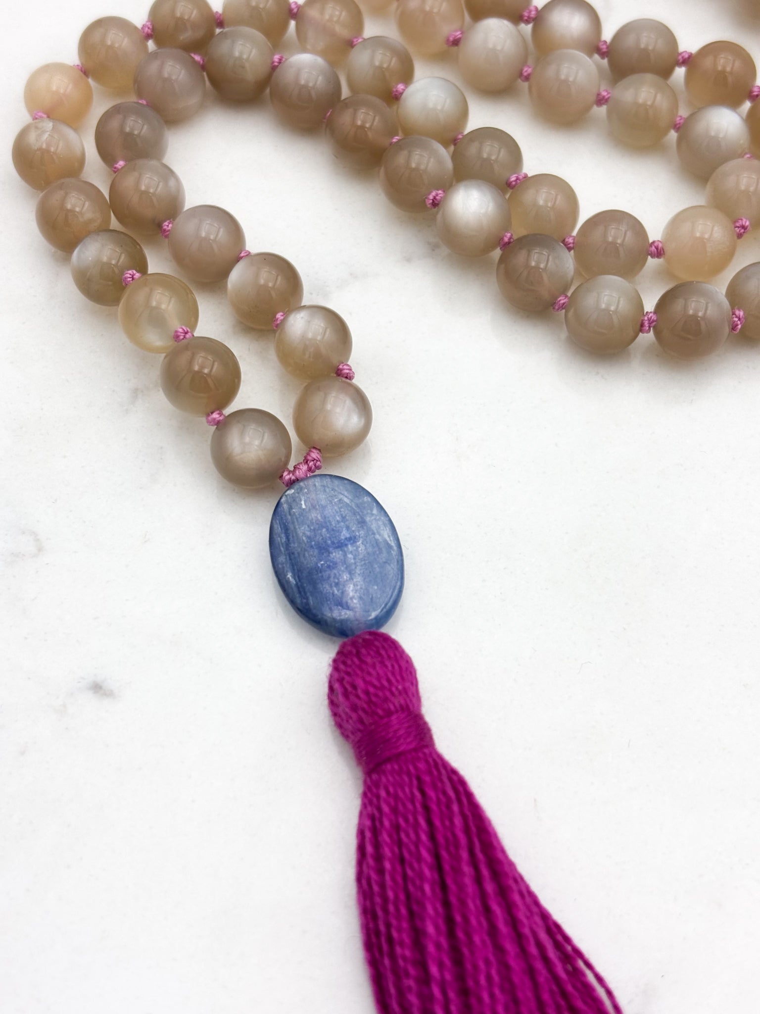 moonstone gemstone mala with kyanite guru bead and bright pink tassel | radiant malas | handmade in boulder, colorado
