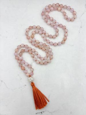 morganite gemstone mala with mosaic mother of pearl guru bead and orange tassel | radiant malas | handmade in boulder, colorado