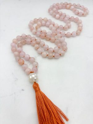 morganite gemstone mala with mosaic mother of pearl guru bead and orange tassel | radiant malas | handmade in boulder, colorado