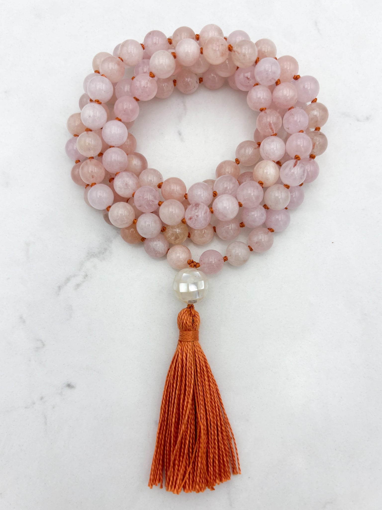 morganite gemstone mala with mosaic mother of pearl guru bead and orange tassel | radiant malas | handmade in boulder, colorado