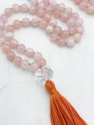 morganite gemstone mala with faceted rock quartz guru bead and orange tassel | radiant malas | handmade in boulder, colorado