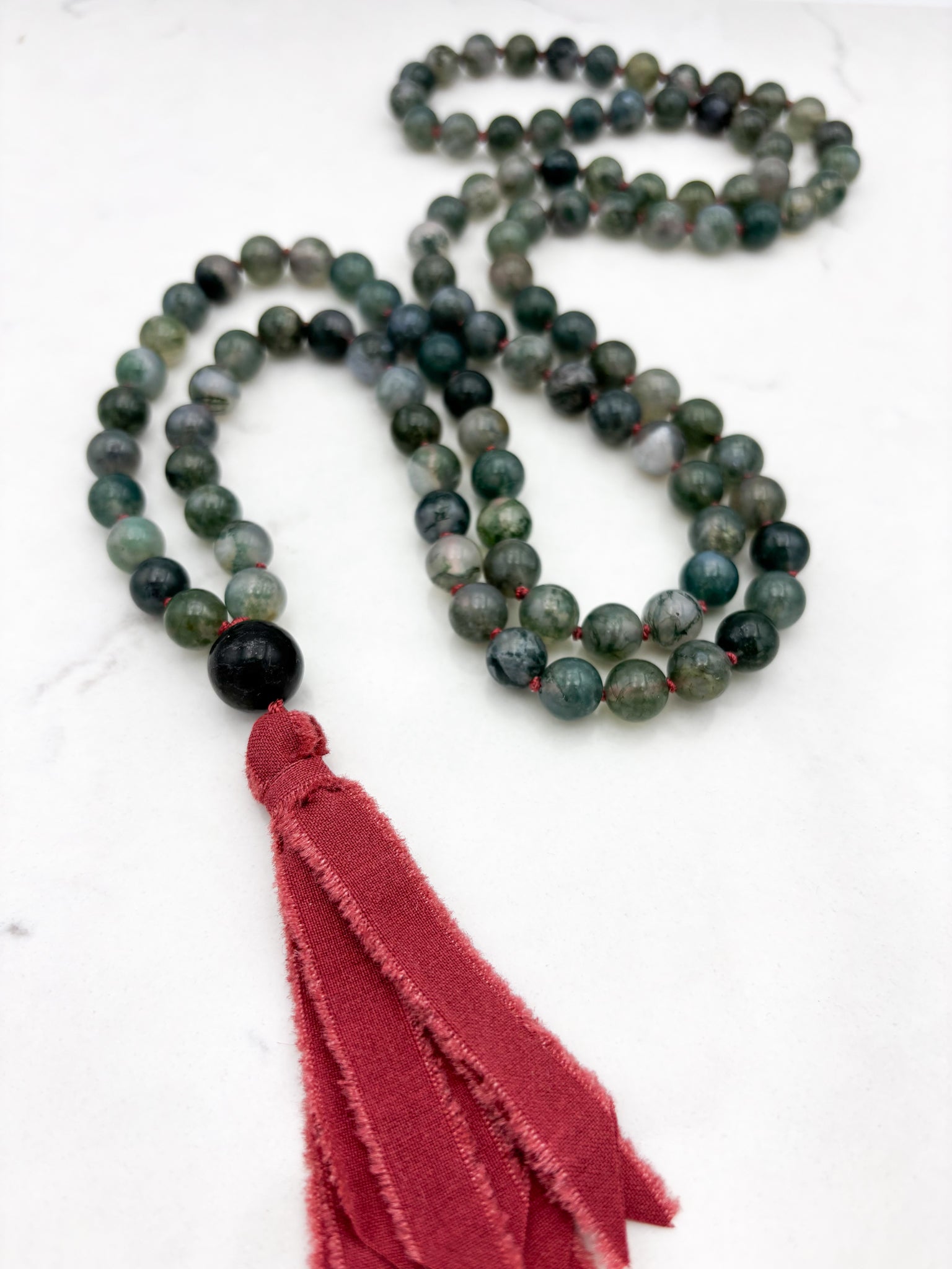 moss agate gemstone mala with jade guru bead and red silk ribbon tassel | radiant malas | handmade in boulder, colorado