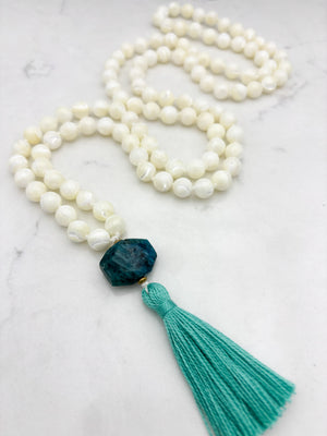 mother of pearl gemstone mala with blue apatite guru bead and teal tassel 
| radiant malas | handmade in boulder, colorado