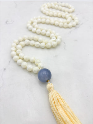 mother of pearl gemstone mala with chalcedony guru bead and pale yellow tassel | radiant malas | handmade in boulder, colorado