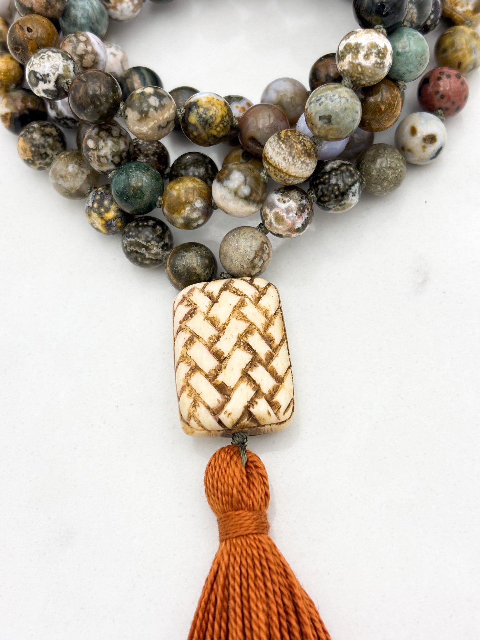 ocean jasper gemstone mala with basketweave carved bone guru bead and rust tassel | radiant malas | handmade in boulder, colorado