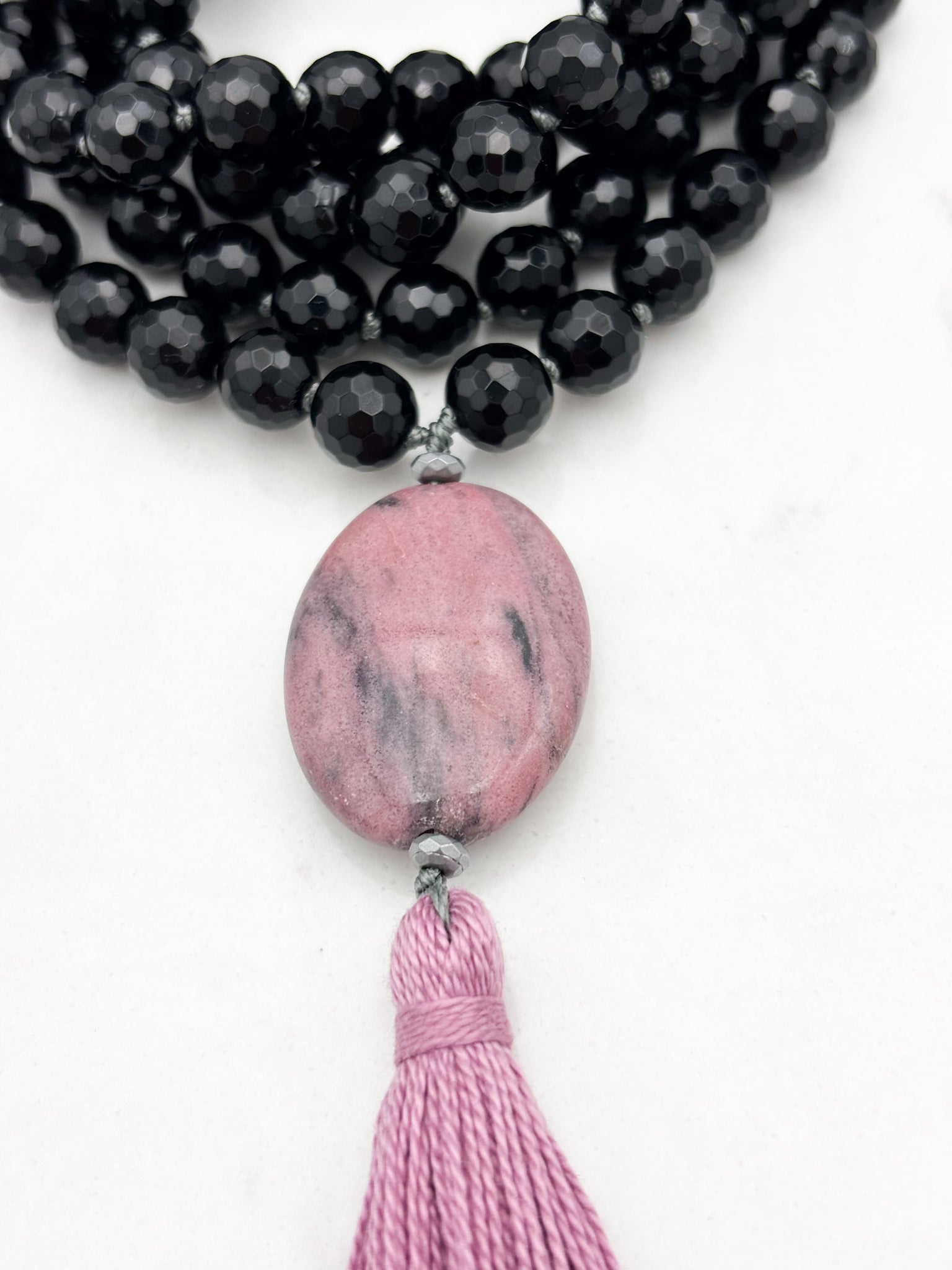 onyx gemstone mala necklace with rhodonite guru bead and pink tassel | radiant malas | handmade in boulder, colorado