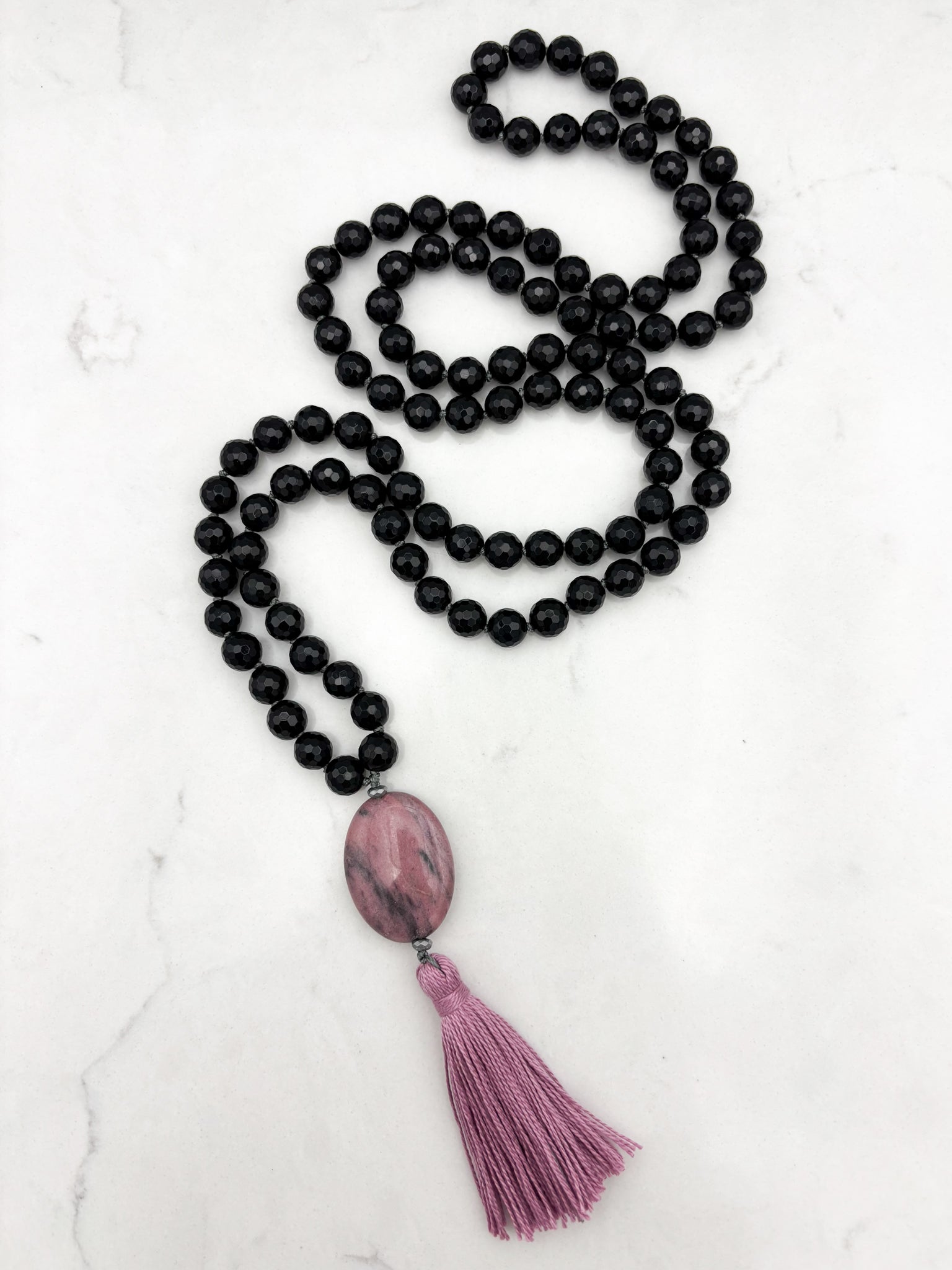 onyx gemstone mala necklace with rhodonite guru bead and pink tassel | radiant malas | handmade in boulder, colorado