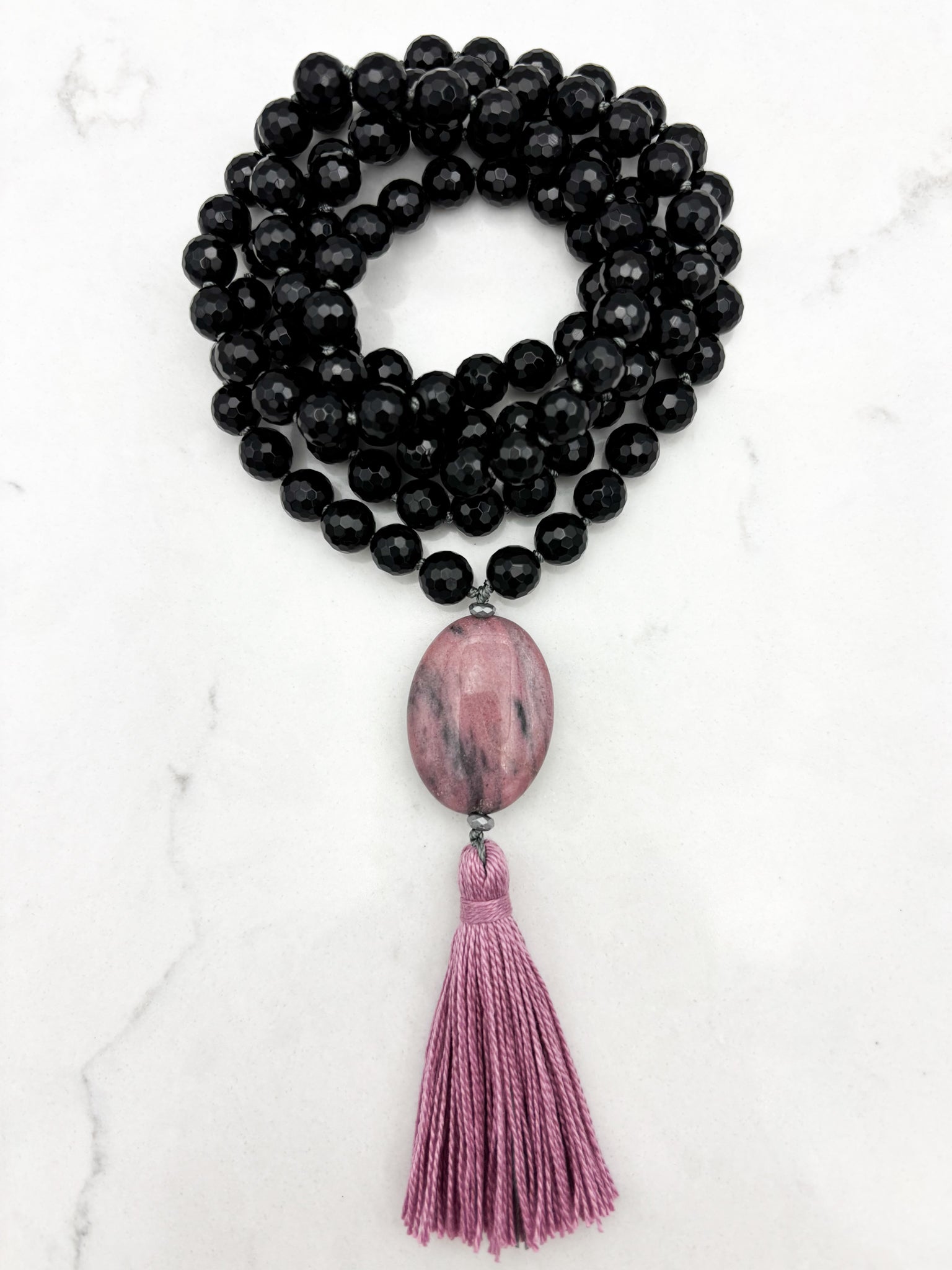 onyx gemstone mala necklace with rhodonite guru bead and pink tassel | radiant malas | handmade in boulder, colorado