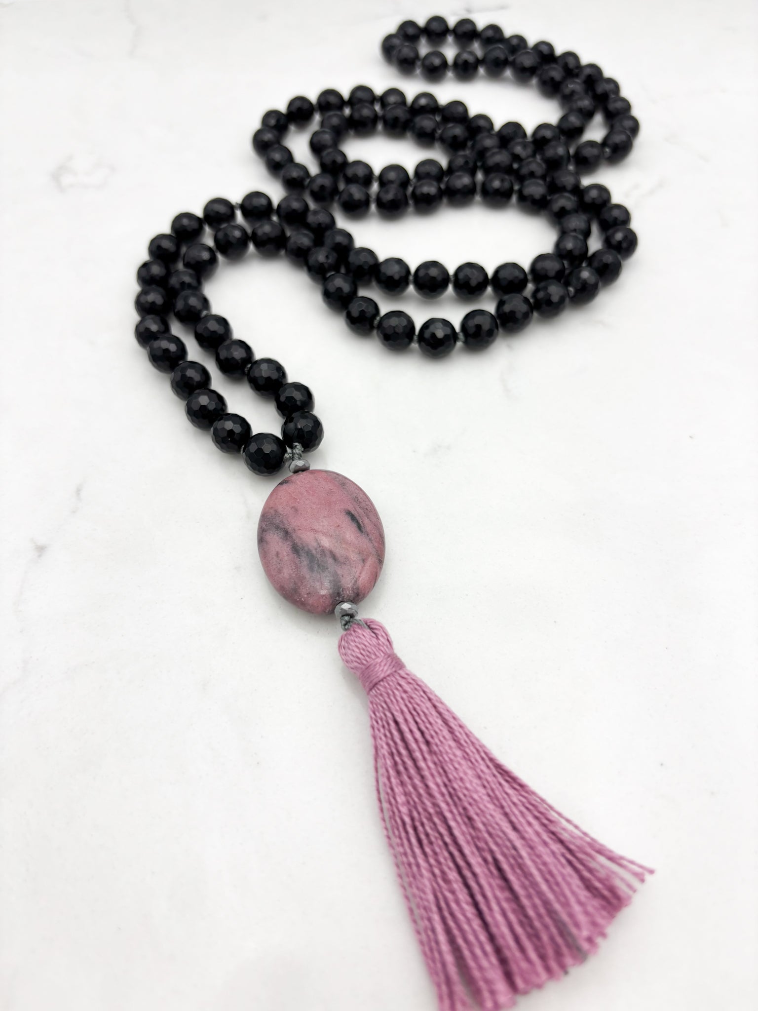 onyx gemstone mala necklace with rhodonite guru bead and pink tassel | radiant malas | handmade in boulder, colorado