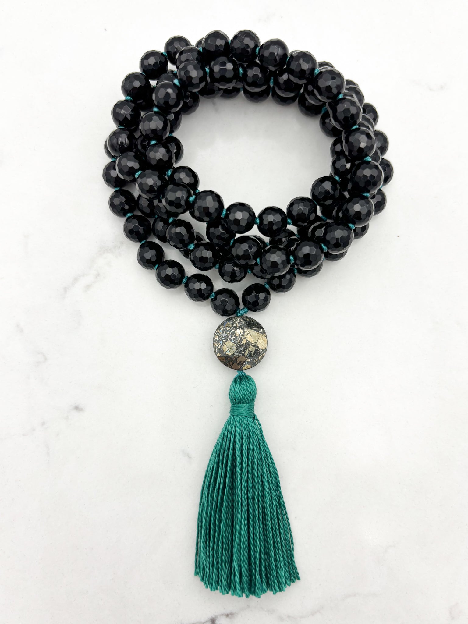 onyx gemstone mala with pyrite guru bead and green tassel | radiant malas | handmade in boulder, colorado