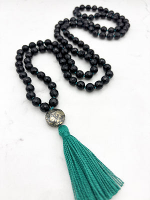 onyx gemstone mala with pyrite guru bead and green tassel | radiant malas | handmade in boulder, colorado